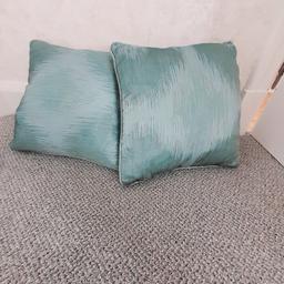 2 fabric cushions covers  17"x 17" with feather cushions. Colour Teal.