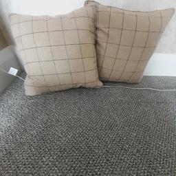 2 - 100% wool checked 
cushion covers with plain backs and feather cushions. 16" x 16".