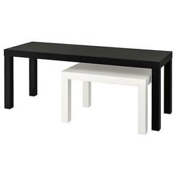 Two Ikea coffee tables which the larger ones have been modified the black ones are joined with clasps and can be separated and with wheels to heighten for the small white tables to move more freely