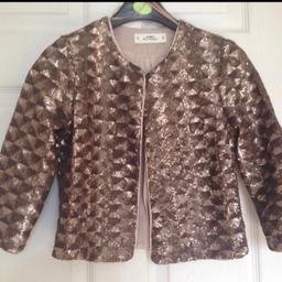 Miss selfridge glamorous petit full sequenced evening jacket in brown /peach /copper colour
Size 8
Only worn once