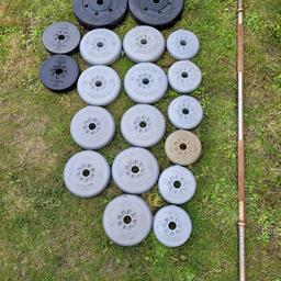 selection of weight plates most of them are York 45kg in total, with heavy duty long bar the bar weighs around 10kg, some storage dust and dirt and the bar has storage rust but all in good usable condition.