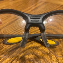 1 light pair of Dewalt safety Glasses (used)with slight marks on the lens but still ok .