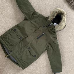 brand new with tags in packaging 
New from Next 
age 3 boys khaki green parka 
winter coat jacket

CHECK OUT MY OTHER LISTINGS LOADS FOR SALE.
