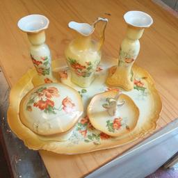 2 candle sticks
1 tray 
1 jug 
1 ring holder
1 bowl with lid,  lid has a  crack on it all other pieces are ok
made by  ges geschiitzt
