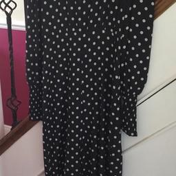 Black spotted jumpsuit by Boohoo size 12 gathered sleeves at wrist. Never worn.