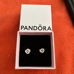 Beautiful Pandora heat earrings, brand new never used, comes in original box. Excellent condition. Needs to go ASAP. Cash on collection, I am happy to post using Royal Mail which costs £4:50 signed for, I am happy to take payment via bank transfer.