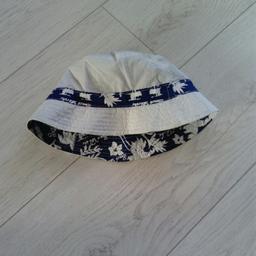 New and never been worn, beautiful reversible bucket hat for a toddler aged around 1-2. Has a South Pacific blue and white surfer style print. From a smoke free, pet free pet free home. Collection only please.