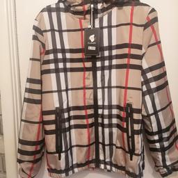 good quality, never worn before. 
dupe of Burberry 
rain jacket