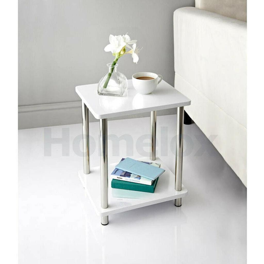 Norsk 2 Shelf Unit.

White high gloss 2 Shelf Unit featuring stainless steel legs.

Fabulous addition to your living room with shelving to place ornaments, photo frames, magazines and books.

Easy self assembly.

Colour: White

Dimensions: W34 x D29 x H41cm (Approx.)
Item Width:
34cm
Pattern:
Solid
Item Length:
29 cm
Item Height:
41 cm
Distance from Floor to Bottom:
41cm
Maximum Length:
34cm
Country/Region of Manufacture:
Unknown
Material:
Wood & Metal
Number of Drawers:
2 shelves
Colour:
White high gloss