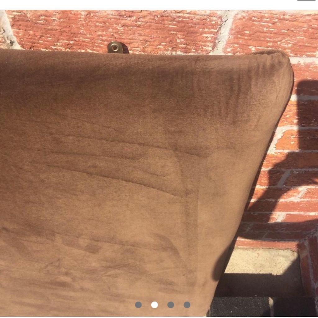 Large brown velvet double bed headboard , it screws to the wall . It was handmade . Still in a good condition . You could turn it upright too maybe for a single bed but the double goes oblong .