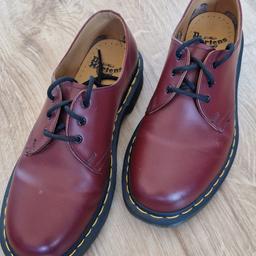 Dr Martens cherry red shoes, size 7. These are in excellent condition and only worn a couple of times for a short time. Only selling as I have far too many pairs.