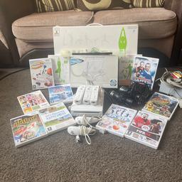 wii bundle with Wii fit board three controllers to nunchucks to mics 11 games and the console stand still in great condition only really been used a few times