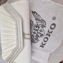 White/Cream clutch bag brand new. came with the marks inside. outside excellent condition