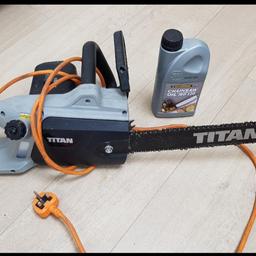 Titan electric chainsaw and oil. Chainsaw used once to do a light job. Still lots of oil left in container..used to fill saw once. collection from IG11 0NR Barking