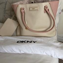 Cream and pink leather tote with attached pouch 
Pockets inside with beautiful DKNY lining 
Great condition 
Bought in USA - not available in UK