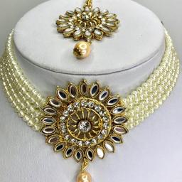 This stunning necklace set will make you turn heads at any occasion.

This Beautiful 3 piece Necklace, Earrings & Headpiece set is perfect for any Occasion. This amazing set is Gold Plated and filled with Stonework and Pearls. As the Jewellery is made from Zinc this is a durable material which will not discolour or corrode.
Care Instructions: Keep away from Water, Body Lotions and Perfumes