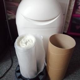 Tommee Tippee Sangenic Nappy Bin. Used but good condition. Comes with x1 cassette reel, x1 cardboard tube to aid lining the bin,  x1 slightly scented roll of bin liner.