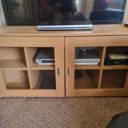 2 door wooden TV cabinet with shelves size 100.5cm length x 40 1/2 width x 49cm height good condition comes from a smoke and pet free home need gone by Monday collection only