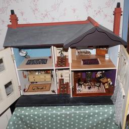 Dolls house with vintage and antique furniture. Please note although dolls houses are for children this is not suitable for a child.
Real glass windows.