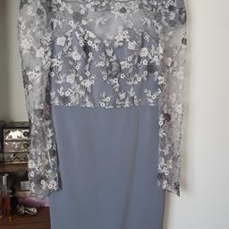 ABSOLUTELY BEAUTIFUL DRESS ...WORN FOR A DAY FOR MY DAUGHTERS WEDDING ...CHI CHI OF LONDON MAKE ..THIS COST ME 85 POUND SO GRAB A BARGAIN ..CLEAN ..JUST PERFECT ...SIZE 12/14 ..IT COMES JUST BELOW THE KNEE ...VERY COMFORTABLE TO WEAR ...COLLECTION ONLY PLEASE ..THE COLOUR IS LAVENDAR BUT NOT SHOWING UP AS GOOD AS IT SHOULD IN THE PIC ..VERY DRESSY ..CAN BE USED FOR ANY OCCASION....NO OFFERS TY I HAVE REDUCED THE PRICE TO THE LOWEST 