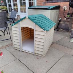 Plastic green and cream keter dog kennel
