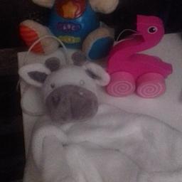 THIS IS FOR A BUNDLE OF BABY TOYS

1 X ELECTRONIC NOISE AND LIGHT RABBIT - REALLY NICE
1 X WHITE GIRAFFE COMFORTER - NICE AND SOFT - NEVER USED
1 X WOODEN FLAMINGO PULL ALONG TOY

USED BUT PLENTY OF LIFE IN THEM


PLEASE SEE PHOTO
