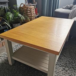 Quality solid oak coffee table.
Think it was a Next table as we bought it off our house seller.

Good condition, few little marks but nothing major and hardly noticeable.
Selling due to space required for toddler!

Shelf feature underneath.

Dimensions are:
60cm wide
1 metre long
40 cm height