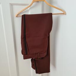 Burgundy pair of Zara Ladies Trousers With black side stripe design. Size: L.