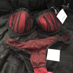 Brand new Ann Summers matching underwear set in blush (black/red). Bra 34C, brief size 10-12. Never worn, hygiene label still in place.