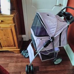 lilac coloured dog pushchair good condition  all zips working  underneath storage cup holders on handle