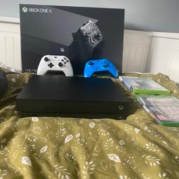 Xbox One X with 2 controllers, charging dock and two games (Cod WW2, Arkham Origins) hardly been used and has been on box.