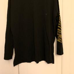 Black long sleeve crew neck top from ASOS with Wu-tang clan Slogans across the back and down the sleeves of the top in yellow writing. Original wu-tang colours. Worn a few times but still got plenty of wears to come out of it. Size medium so between 12-14. Loose fit and cosy to wear.