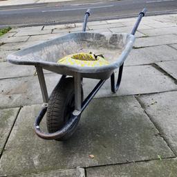 Used wheelbarrow with spare tyre