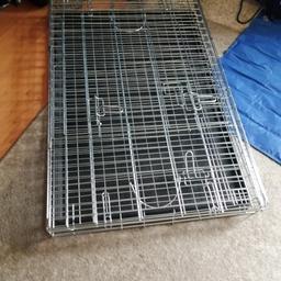 Large metal dog cage. Folds flat as pictured has front and side doors size is 91xm length. 62cm width and 69cm height collection only open to offers