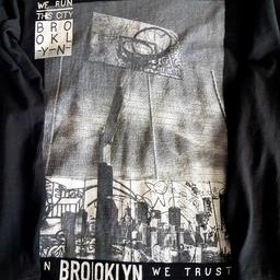 Black Brooklyn long sleeve top by Next, Age 11. Worn but in good condition.