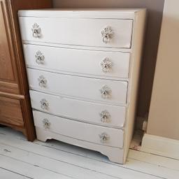 We are selling our chest of drawers 5 drawers in total with old style handles. has been painted to make it look shabby chic. Was originally dark wood. So painted white then a pink/cream colour over to give the layered look where its been rubbed back. And looks nice over all. It is made of solid wood and very solid piece of furniture. Collection only. Redditch. Size 760 wide, x 1030 high and 470 deep. Cash on collection only please. 