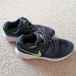 Navy blue boys Nike trainers, size 13. Used condition but plenty of life left. From a smoke and pet free home.