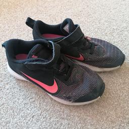Girls black and pink Nike trainers. Worn condition but plenty of life left. From a smoke and pet free home. Size 1.