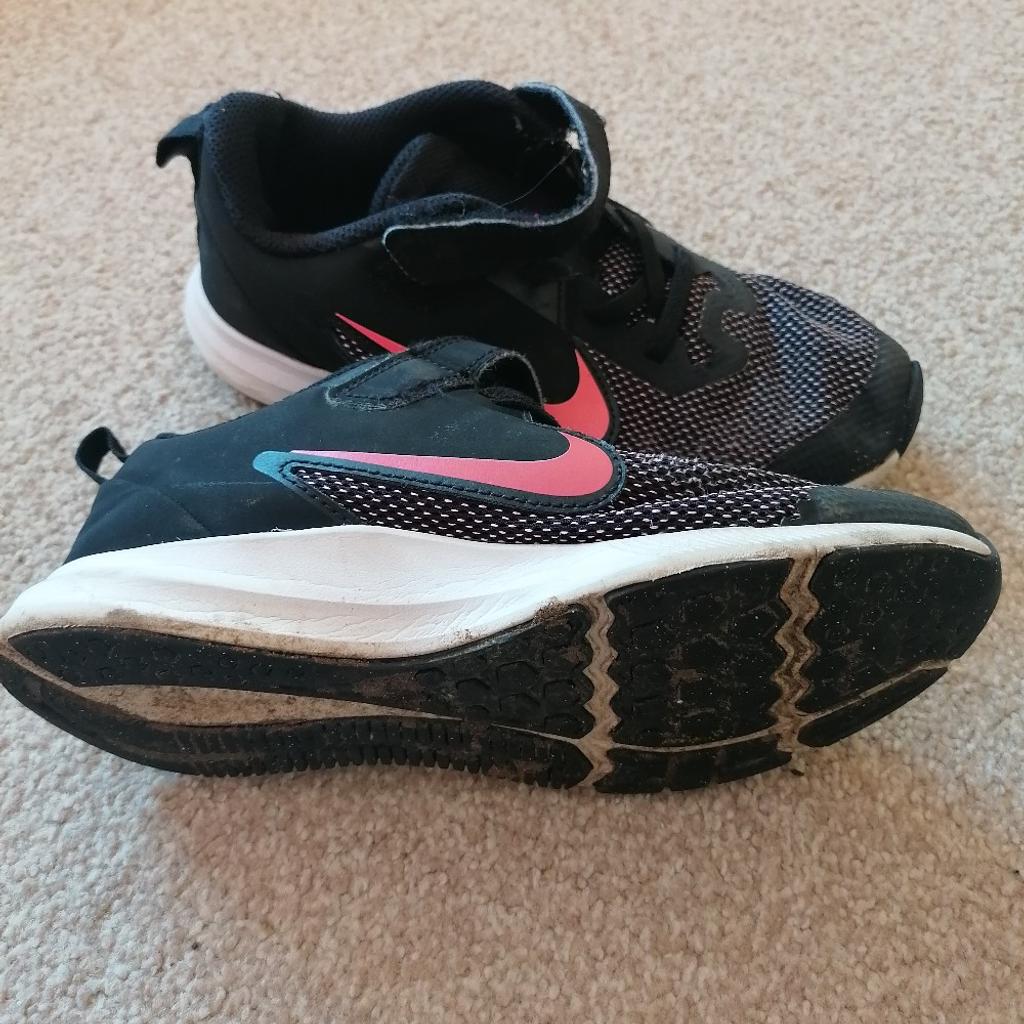 Girls black and pink Nike trainers. Worn condition but plenty of life left. From a smoke and pet free home. Size 1.