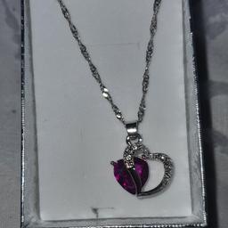 brand new sliver necklace. comes in a little box.