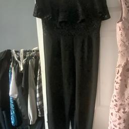 selling a lovely jump suit . it's black from quiz . only worn once. lovely detail. .