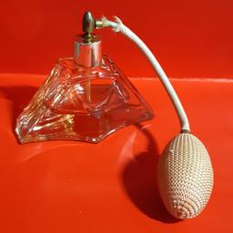 Vintage cut glass perfume atomiser
has a couple of tiny nibbles to bottle. tube covering is frayed. works ok. see images for details.