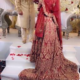 Absolutely stunning blood red and antique gold embroidered dress. fits a small. Got married on 10th september 2022. Red trail and crown embroidery on scarf. Straps are on to hold up lengha as its got heavy work on it.