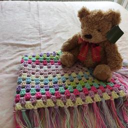 beautiful multicoloured hand crocheted blanket. Ideal gift for Christmas. 45cm.

teddy not included