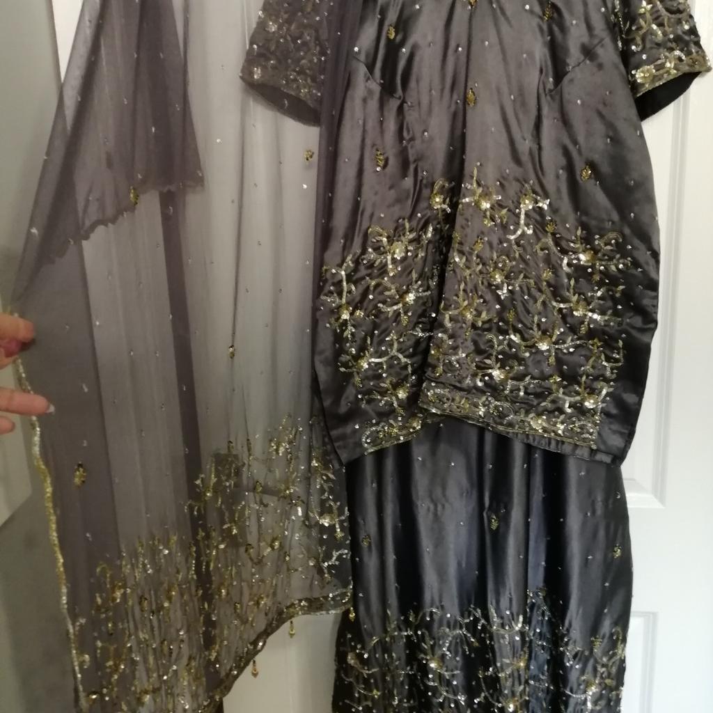 A plus size lengha suit size 24 in grey, both are fully lined, with loads of detailed work, long skirt with zip, also the top has a zip,would fit a size 22/24 please see sizes for both, collection from LE4 or can post for extra cost, please ask for more measurements if required as can not be returned.