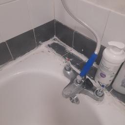 hi I need new tiling and sealant for bath as picture shown