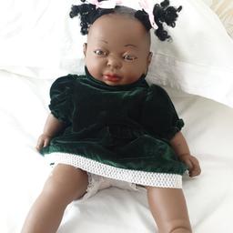 Lovely ethnic J Berna doll. wearing green velvet dress and knickerbockers.. soft bodied doll . body has been sewn as in picture  but not visible when dressed. delightful little girl. will accept £7 ono.