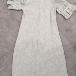 little girls occasion/party dress in cream with applique work on the top. short sleeves. roughly age 8 years. excellent condition.  only been worn a couple of times.