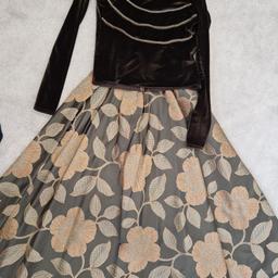 ladie two piece skirt and top set in brown and copper. Full sleeves. only worn a couple of times.  excellent condition.  zip opening on the back of the top and on the side of the skirt