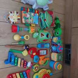 large bundle of baby toys. selection of rattles, musical, soft baby toys